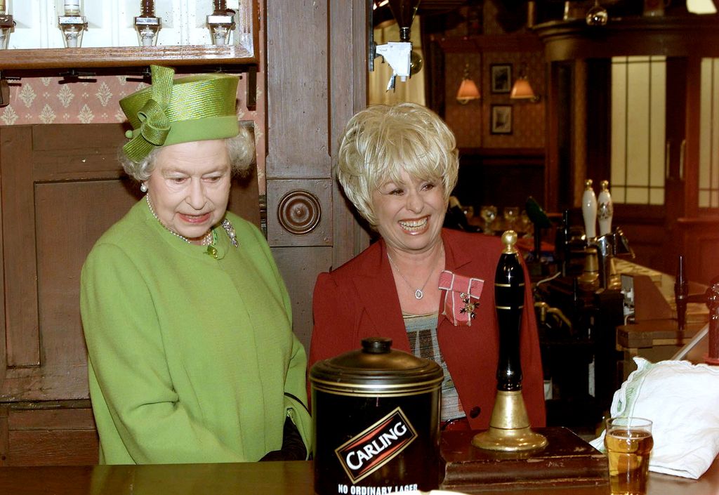 Queen Elizabeth with Barbara Windsor on the set of EastEnders 