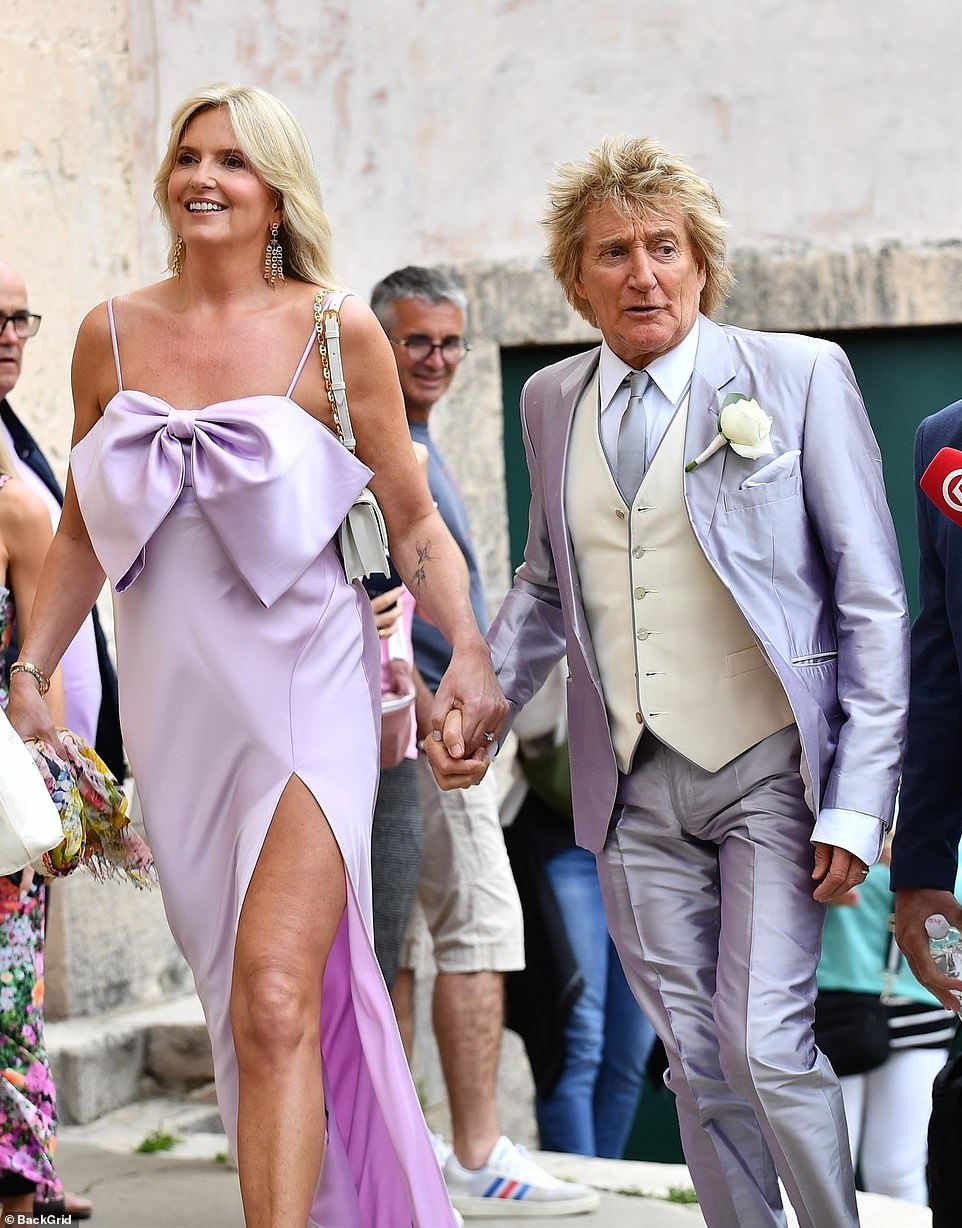 Rod wore a silver satin trouser suit and a pale yellow waistcoat.