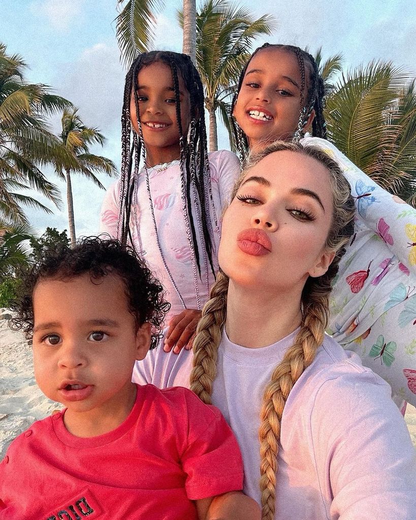 Khloe Kardashian at the beach with her children True and Tatum and niece Dream