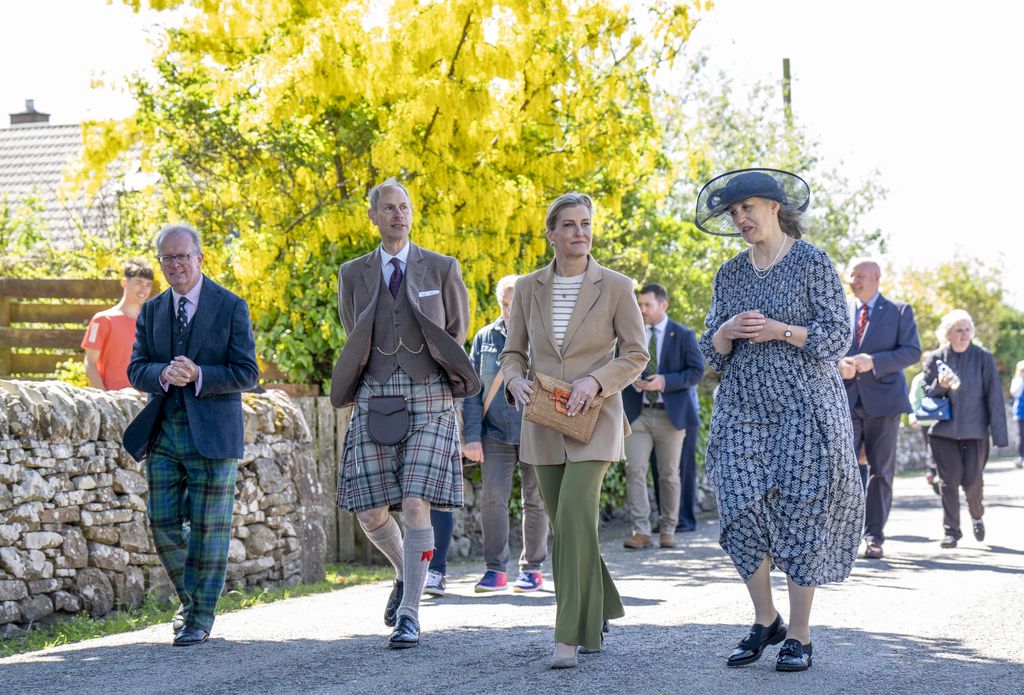 The Duke and Duchess of Edinburgh walk through the village with Lord Lieutenant Patrick Marriott (left) and Golspie Community Council Chairwoman Henrietta Marriott (right) during their visit to Golspie, Sutherland. 