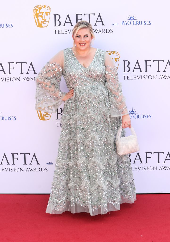 Woman in sparkling dress on the BAFTA red carpet