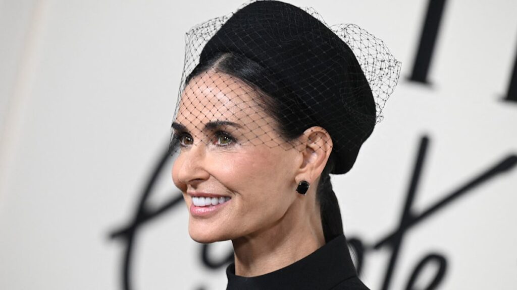 Demi Moore, 61, surprises in waist-defining trousers and dramatic facial veil