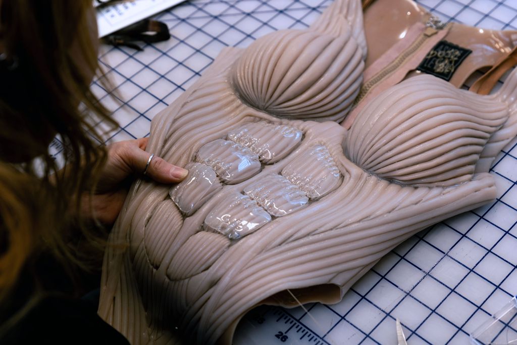 A BTS photo from the creation of the bodysuit by Asher Levine for Doja Cat's performance at Coachella
