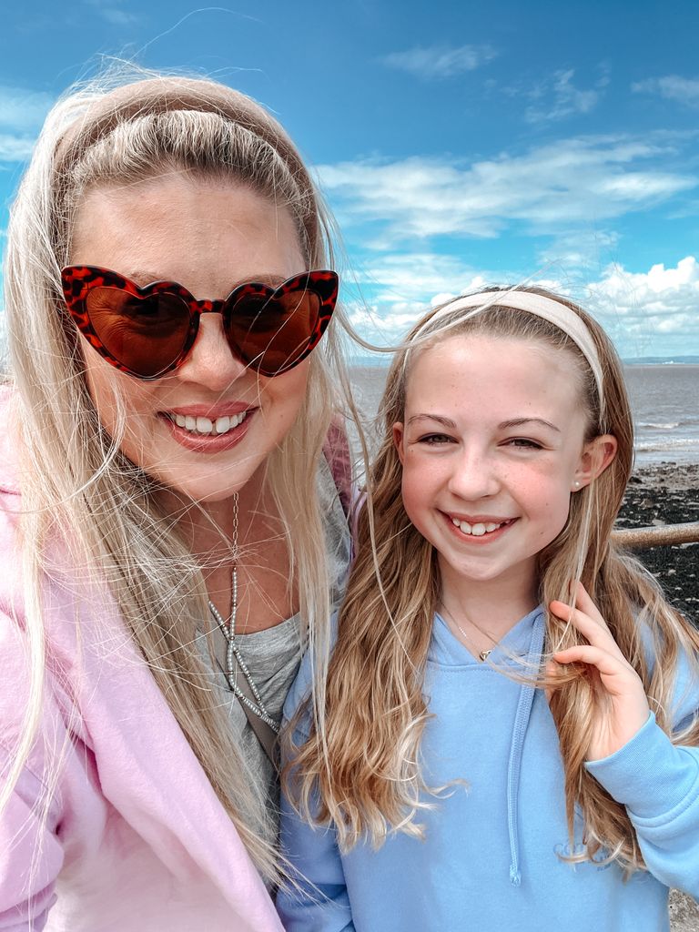 woman and daughter smiling for a selfie 