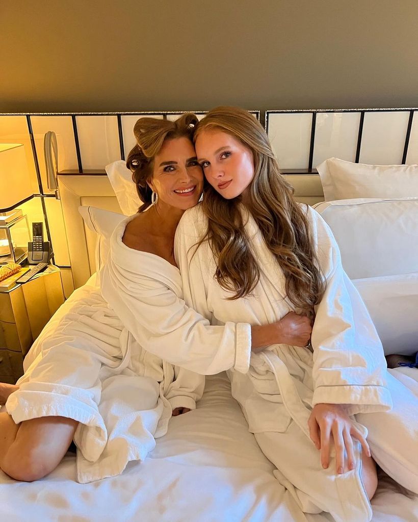 Brooke Shields in waving robes in bed with her teenage daughter Grier