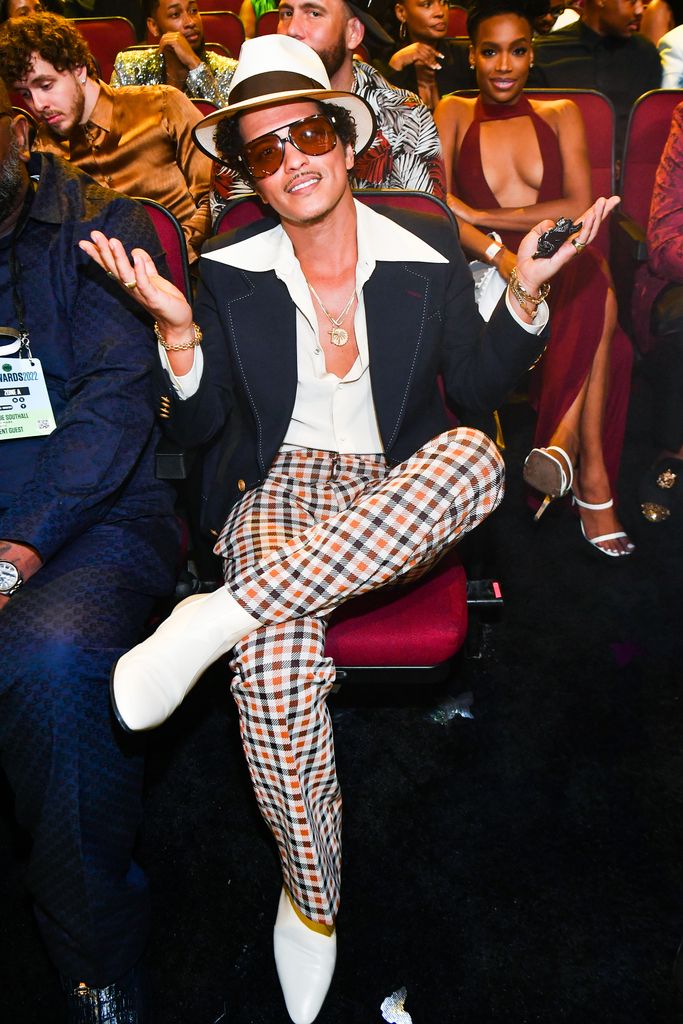 Photo of Bruno Mars wearing checkered trousers