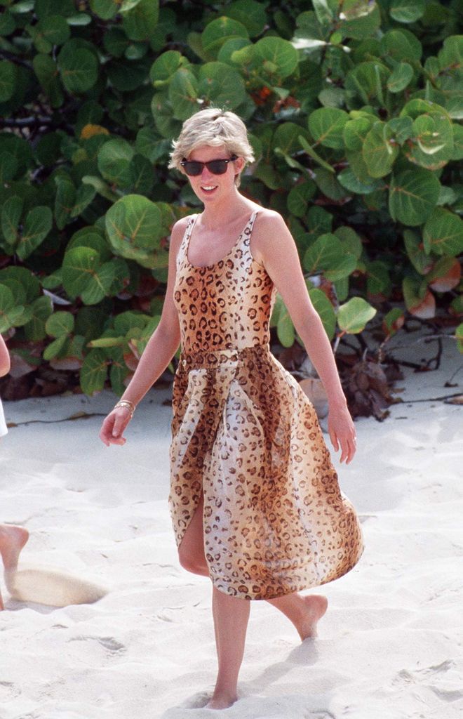 Princess Diana vacations on Necker Island in the Caribbean in a leopard-skin swimsuit and sarong  
