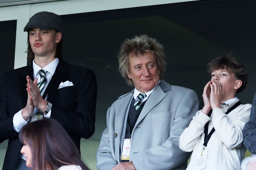 Alastair Stewart, Rod Stewart and Aiden Stewart watching a football match