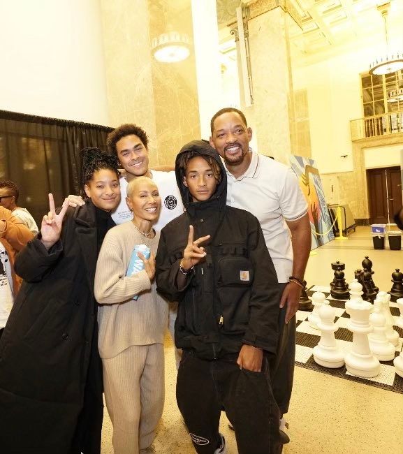 Photo shared by Pratt Library in Baltimore of Will Smith, Jada Pinkett-Smith and their children Trey, Willow and Jaden on the book tour for Jada's memoir Worthy.