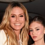 AGT’s Heidi Klum highlights her very toned legs in a feathered mini dress just like daughter Leni’s