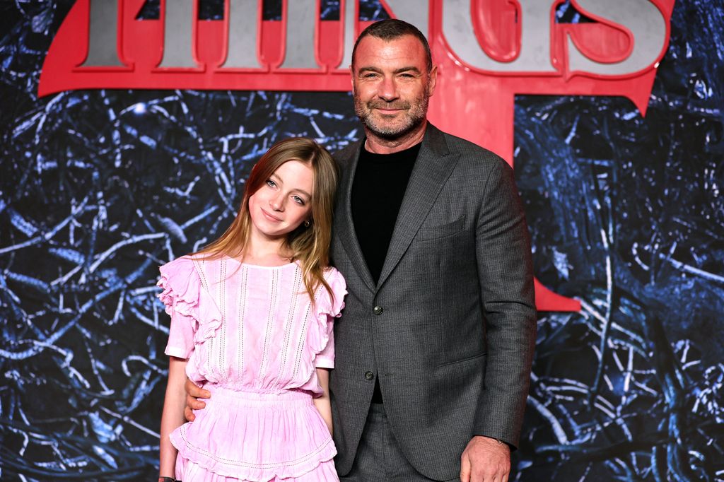 Kai Schreiber in a red carpet dress with his father, Liev