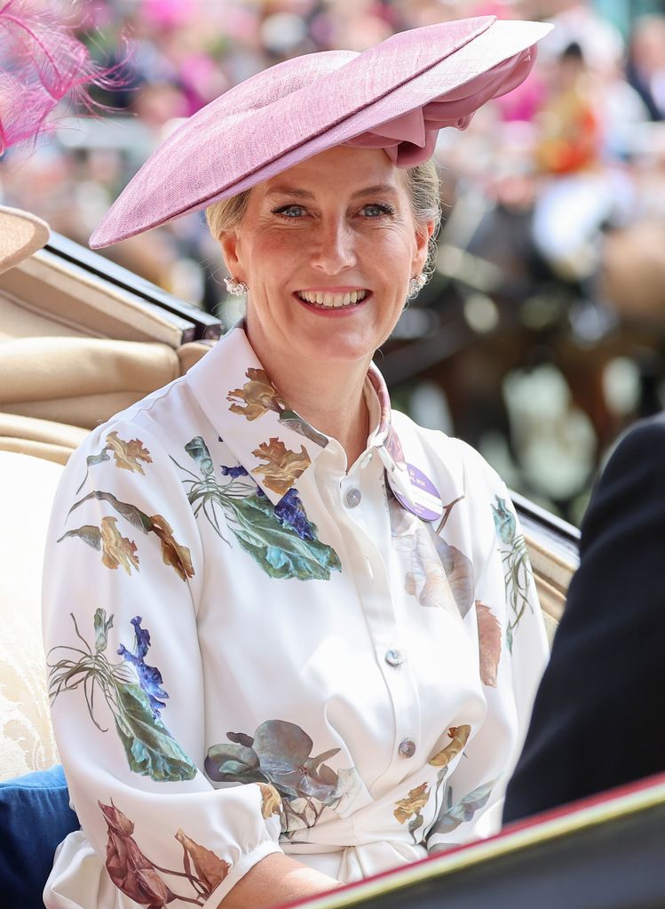 The Duchess of Edinburgh wearing a floral shirt dress and pink hat