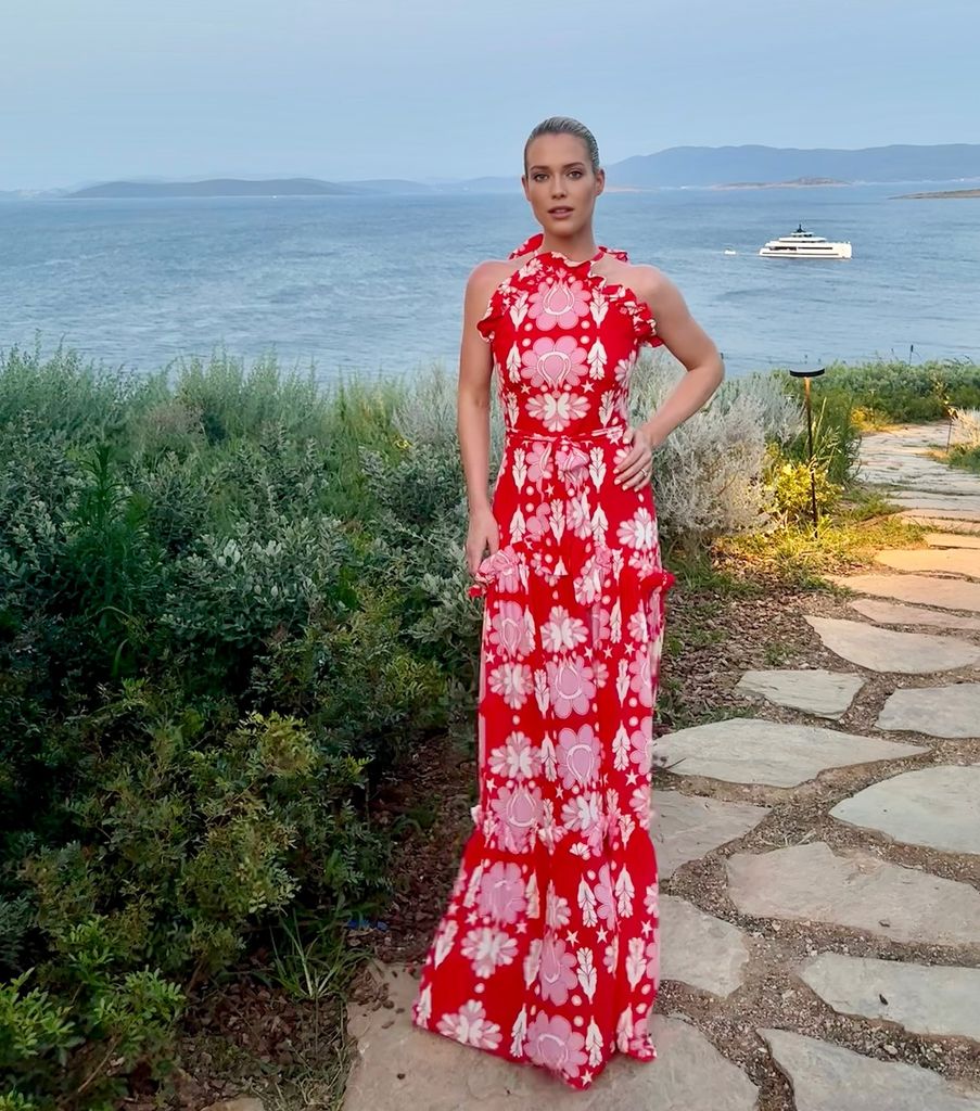 Amelia Spencer at sunset in a red patterned dress