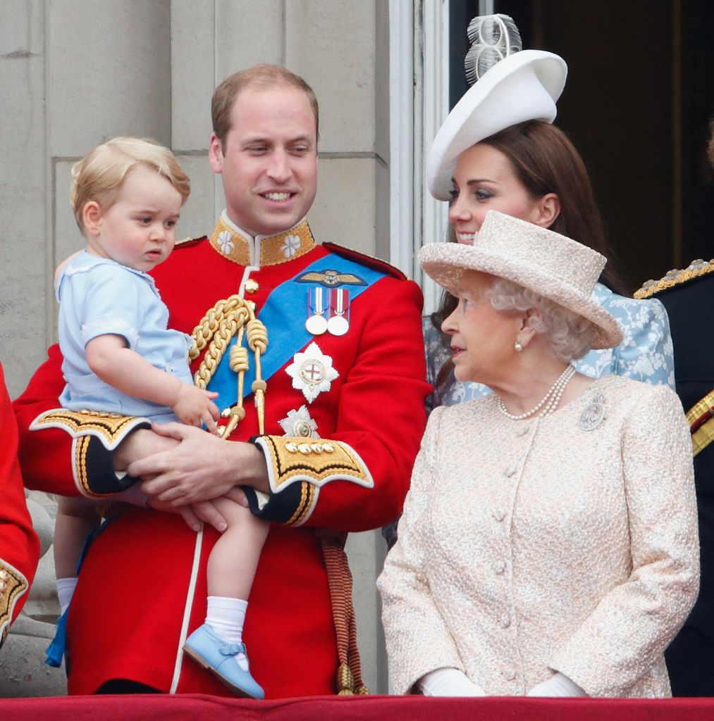 Queen Elizabeth II smiles at Prince George on the balcony