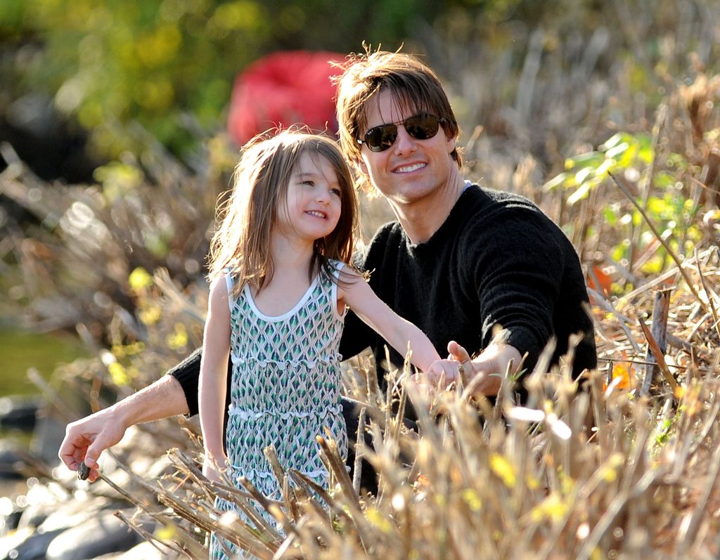 Suri Cruise and Tom Cruise visiting the Charles River Basin on October 10, 2009  