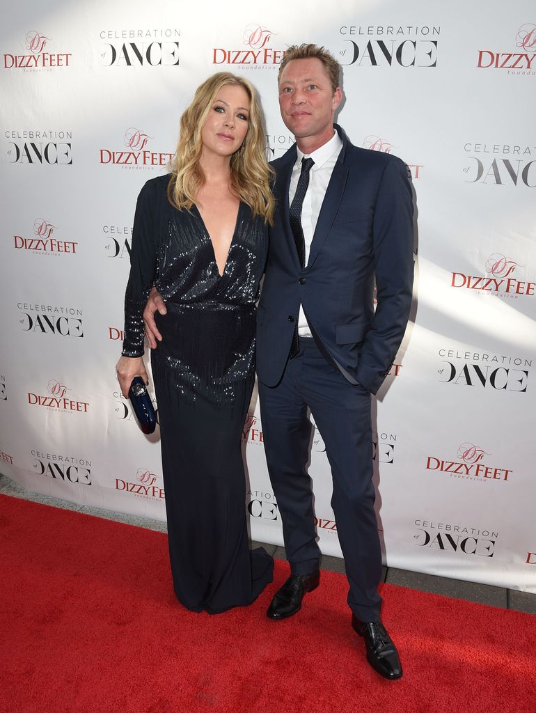 Christina Applegate and bassist Martyn LeNoble attend the 5th Annual Dance Gala presented by The Dizzy Feet Foundation at Club Nokia on August 1, 2015 in Los Angeles, California.