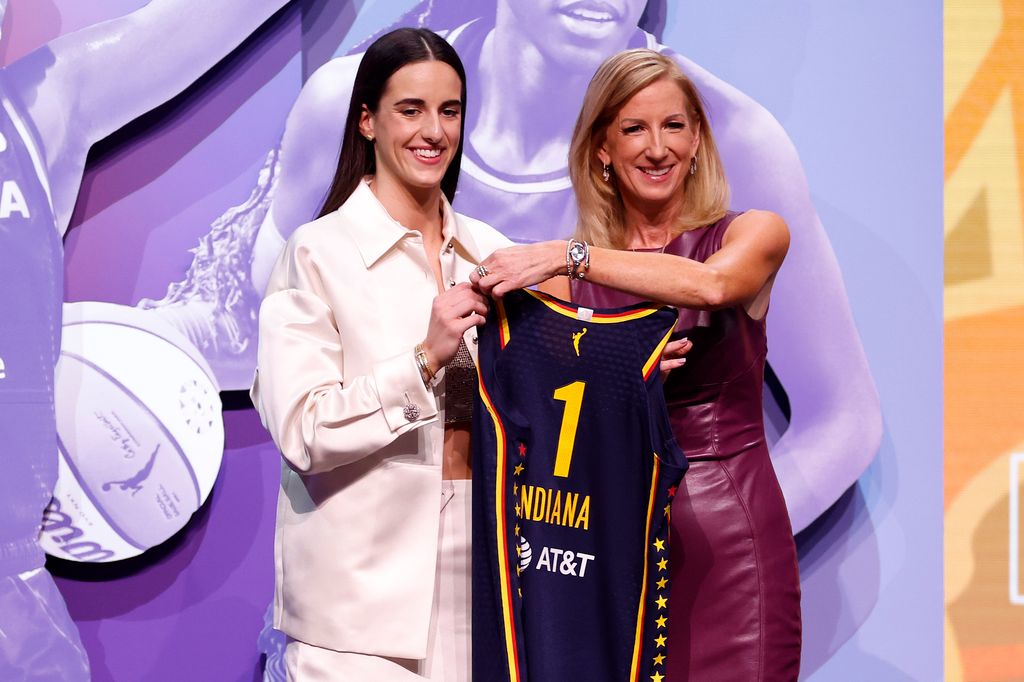 Caitlin Clark poses with WNBA commissioner Cathy Engelbert after being selected with the first overall pick by the Indiana Fever during the 2024 WNBA Draft
