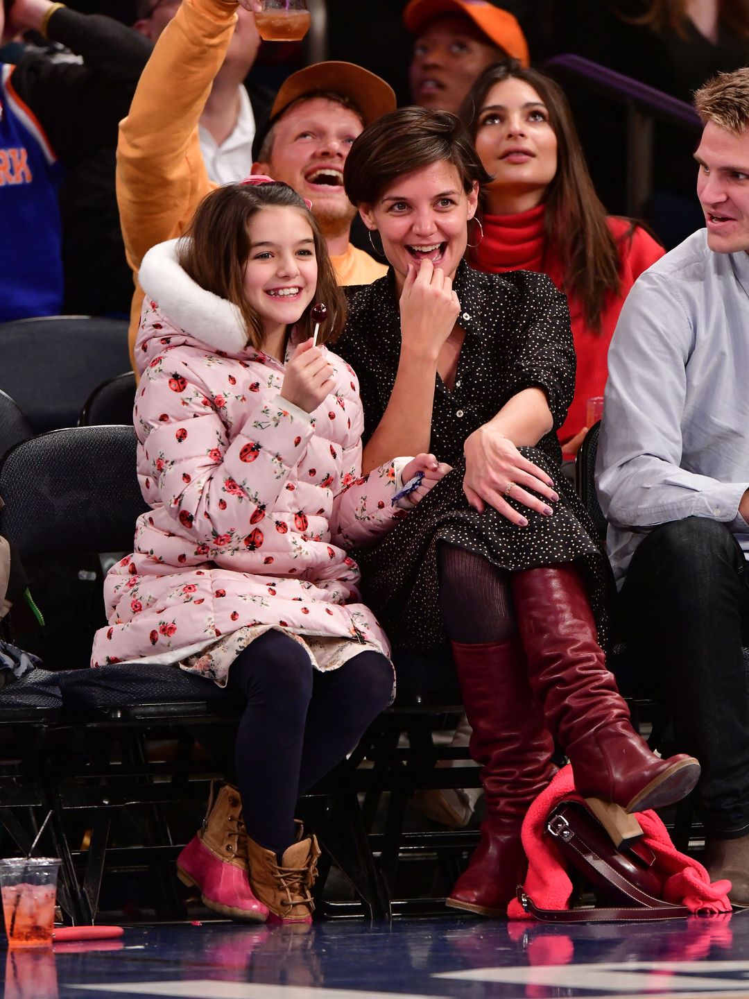 Suri Cruise and Katie Holmes attend the Oklahoma City Thunder vs. New York Knicks game at Madison Square Garden on December 16, 2017 in New York City.