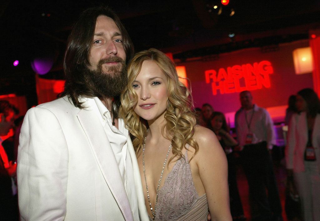 Kate Hudson and her husband, musician Chris Robinson, pose while attending a party after the premiere of the romantic comedy Raising Helen in 2004