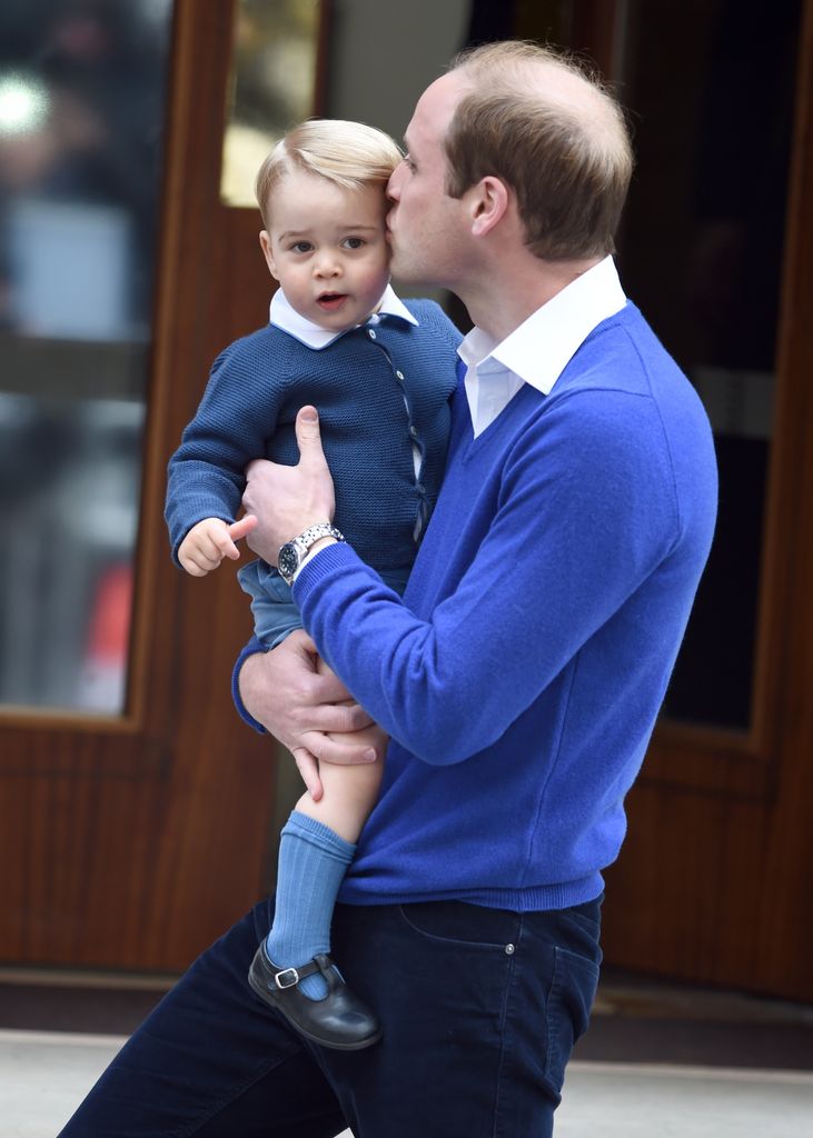 Prince William kisses Prince George