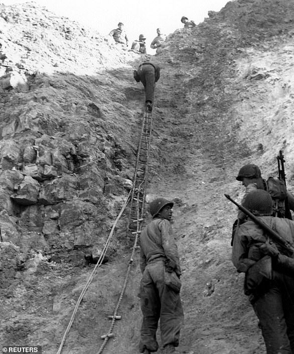 US Army Rangers show off the ladders they used to storm the cliffs which they assaulted in support of Omaha Beach landings at Pointe du Hoc. At the end of the two-day action, the initial Ranger landing force of 225 or more was reduced to about 90 fighting men