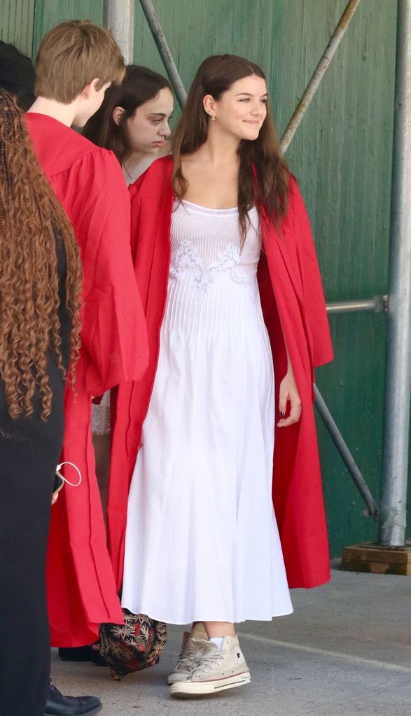 Suri wore a red gown, a white dress and Converse sneakers