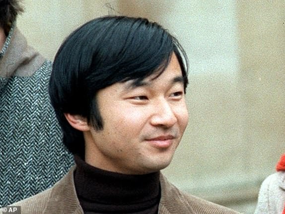 In this Dec. 1983, photo, then Prince Hiro, current Crown Prince Naruhito, left, chats with friend Keith George, right, at Merton College at Oxford in England. The two young men hit it off from the start, and George, a friend of Naruhito's since their days at Oxford, remembers Naruhito both for his sense of humor and their shared love of music: George played blue grass and country music on the banjo, and Naruhito played the viola. (Kyodo News via AP)