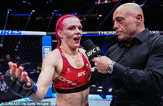 LAS VEGAS, NEVADA – JUNE 29: Gillian Robertson of Canada speaks to UFC commentator Joe Rogan after her win against Michelle Waterson-Gomez in a strawweight fight during the UFC 303 event at T-Mobile Arena in Las Vegas, Nevada on June 29, 2024. (Photo by Jeff Bottari/Zuffa LLC via Getty Images)