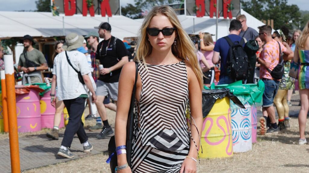 Lila Moss cosplays mother Kate Moss in sheer outfit at Glastonbury 2024
