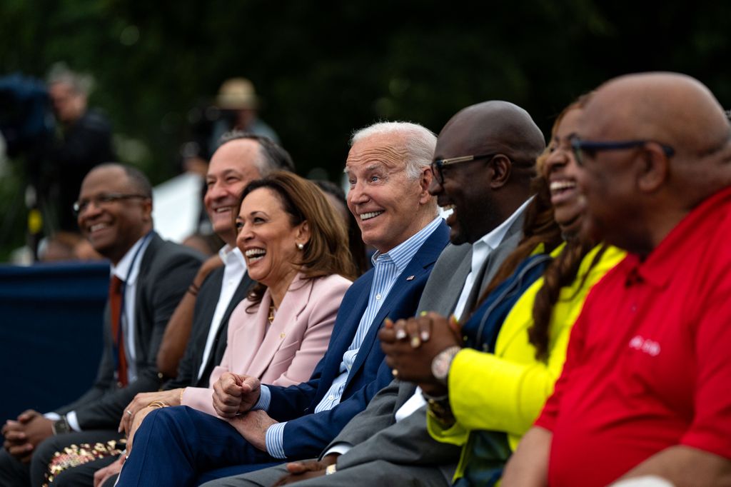 WASHINGTON, DC - JUNE 10: U.S. President Joe Biden (center), with Second Gentleman Doug Emhoff (left) and Vice President Kamala Harris, attends the Juneteenth concert on the South Lawn of the White House in Washington, DC on June 10, 2024. Biden signed legislation in 2021 establishing Juneteenth as a federal holiday that commemorates the end of slavery in the United States. (Photo by Kent Nishimura/Getty Images)