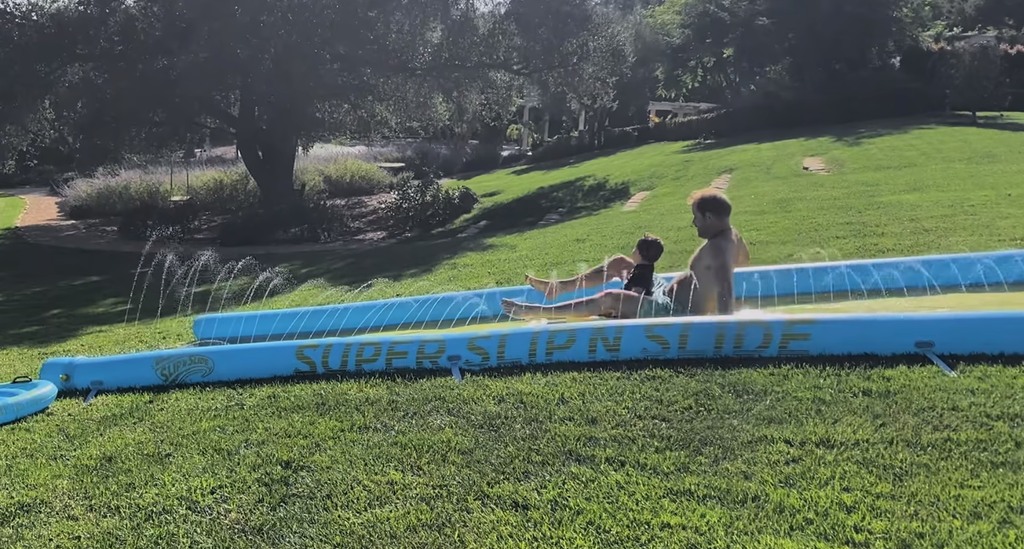 Prince Harry and Meghan's garden has a hill that's perfect for water fun