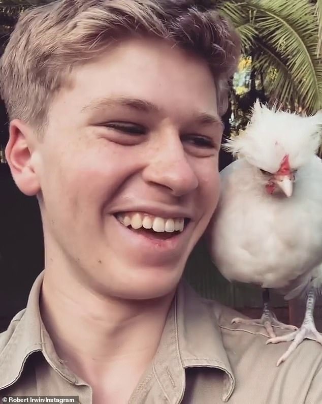 The 20-year-old wildlife warrior stars in a new advert asking snack fans to vote for their favourite Twisties flavour: chicken or cheese