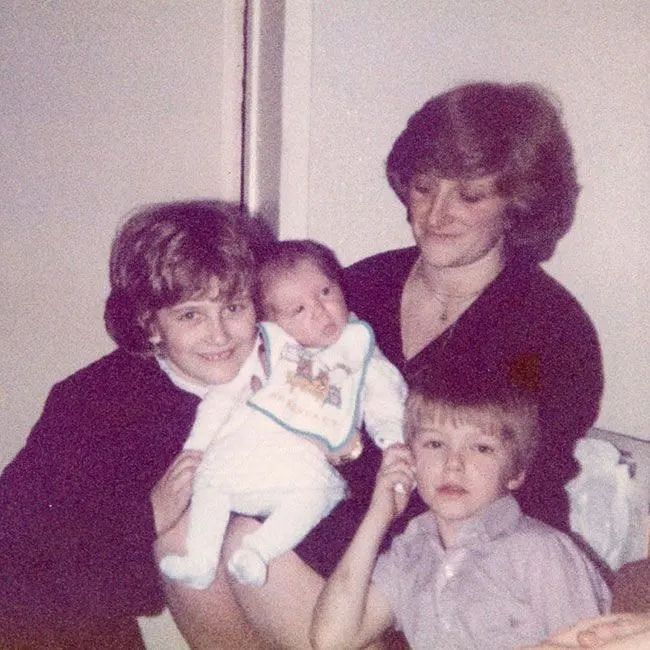 David shared an adorable childhood photo with his sisters and mother