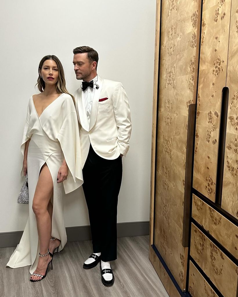 Jessica Biel in a white satin thigh split dress with husband Justin Timberlake in a white tux