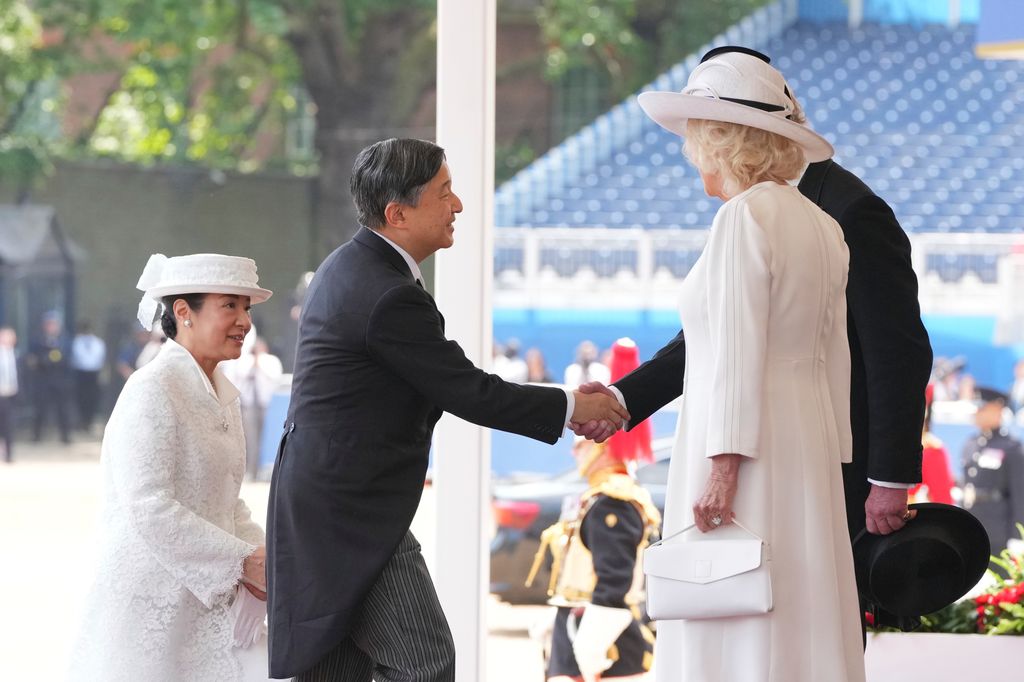 King Charles shakes hands with Emperor Naruhito of Japan during a formal welcome