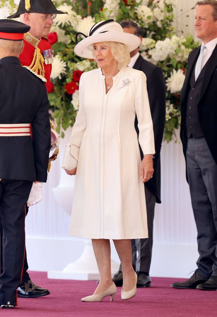 Queen Camilla smiles before the formal welcome of Emperor Naruhito and Empress Masako of Japan