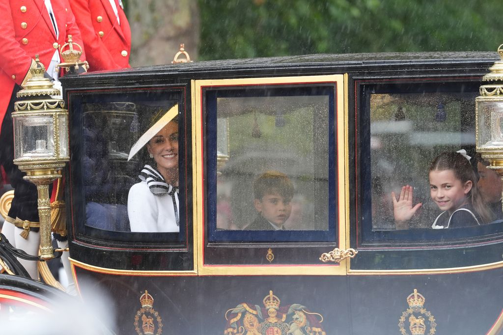 Princess Kate, Prince Louis and Princess Charlotte travelling along The Mall following the Trooping the Colour ceremony at Horse Guards Parade