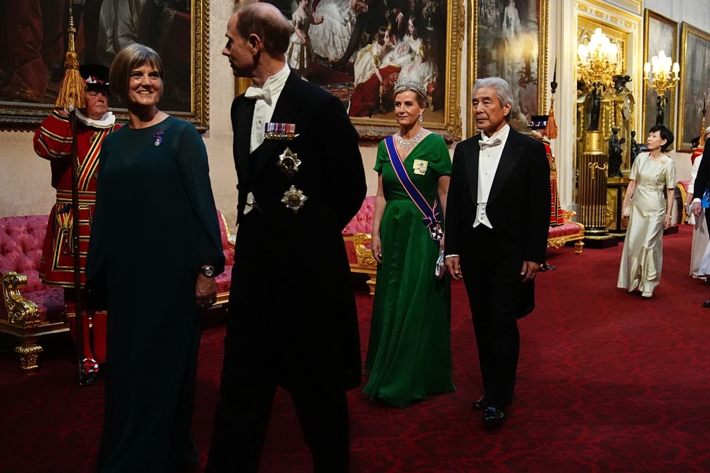 Ms Julia Longbottom (left), Prince Edward, Duke of Edinburgh, Sophie, Duchess of Edinburgh and His Excellency Mr Hirofumi Nakasone (right) walking through the East Gallery 