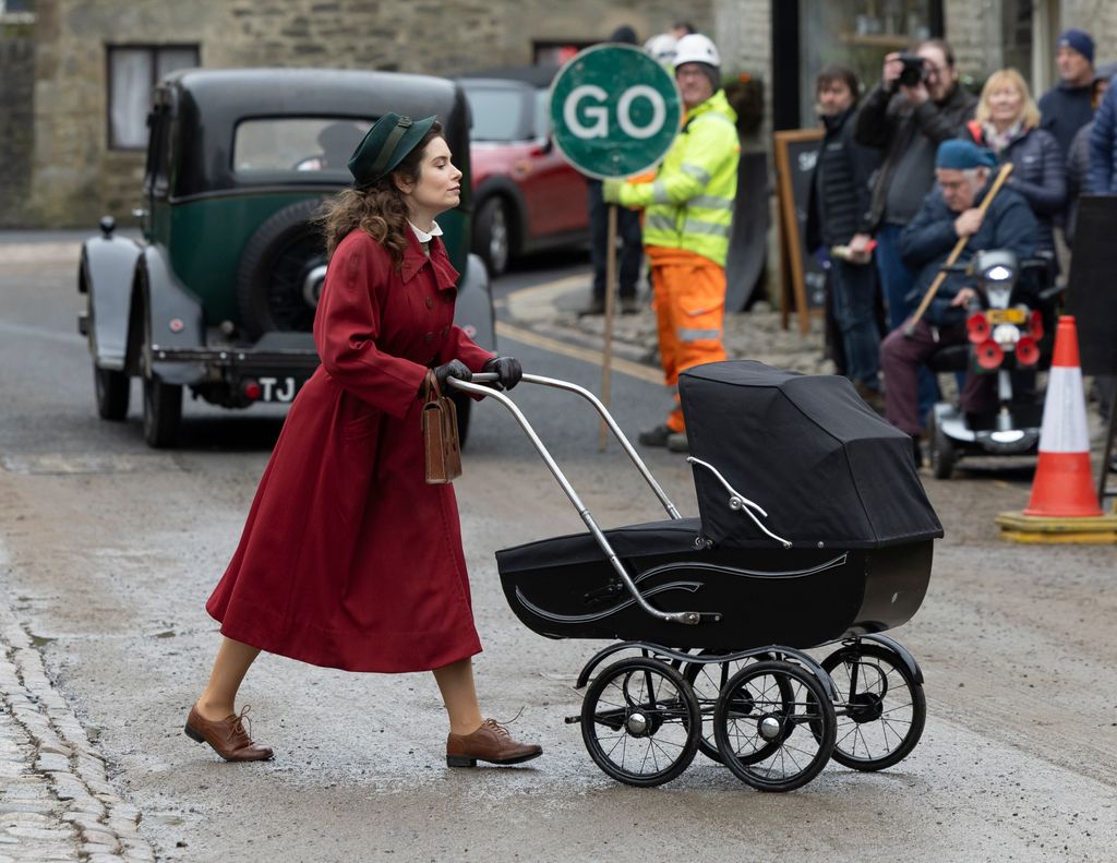 Rachel Shenton pushing a baby carriage