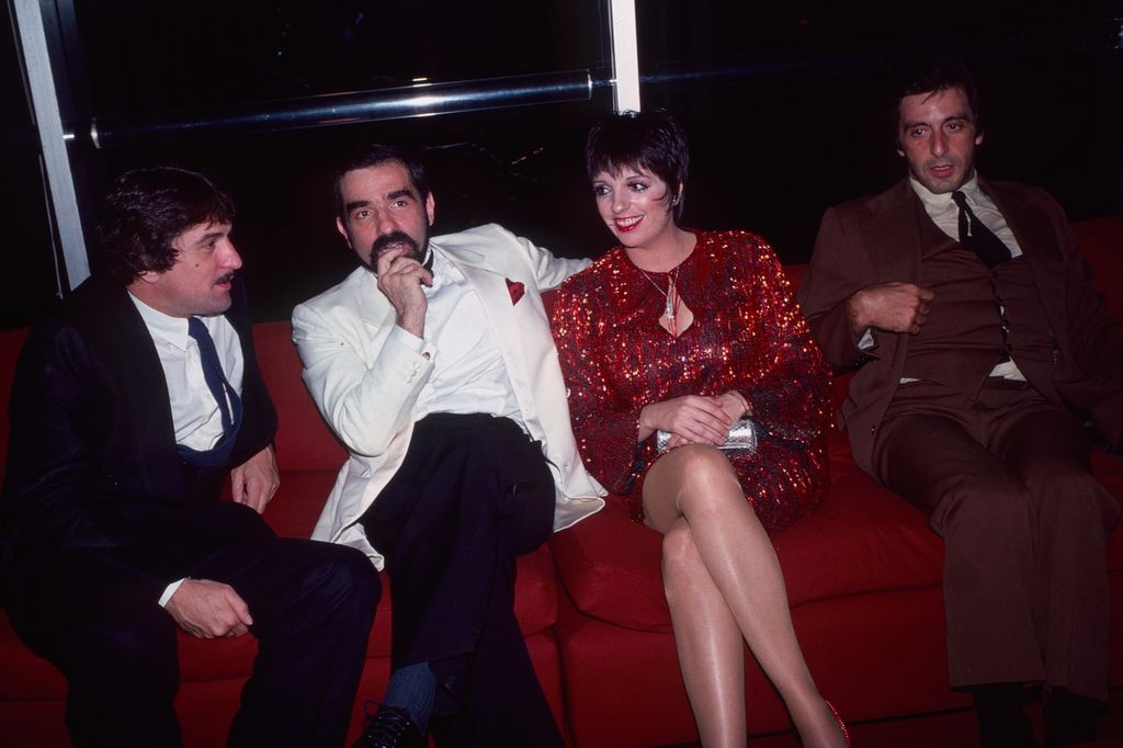 From left, American actor Robert De Niro, film director Martin Scorsese, and actors Liza Minnelli and Al Pacino, as they sit together on a couch at an unidentified event, New York, New York, 1981