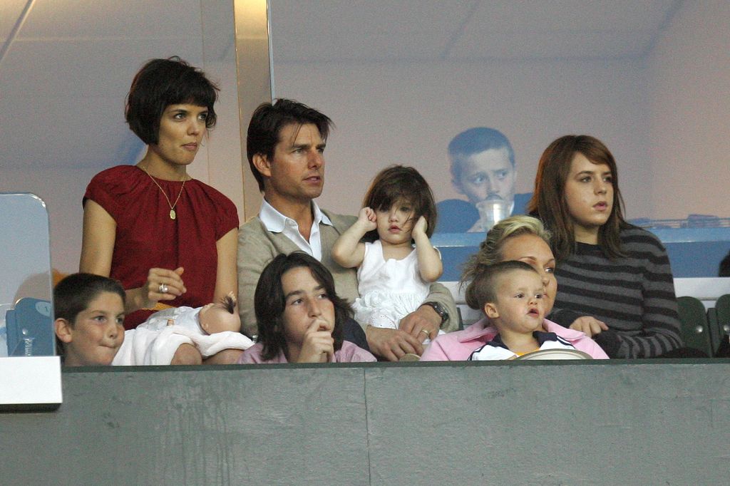 Katie Holmes (left) and Tom Cruise with their daughters Suri Cruise (center) and Isabella Kidman-Cruz (right), along with David Beckham's sons Cruz Beckham (front second from right) and Brooklyn Beckham (back), watch a Major League Soccer match between the New York Red Bulls and LA Galaxy at the Home Depot Center in Carson, California on May 10, 2008.