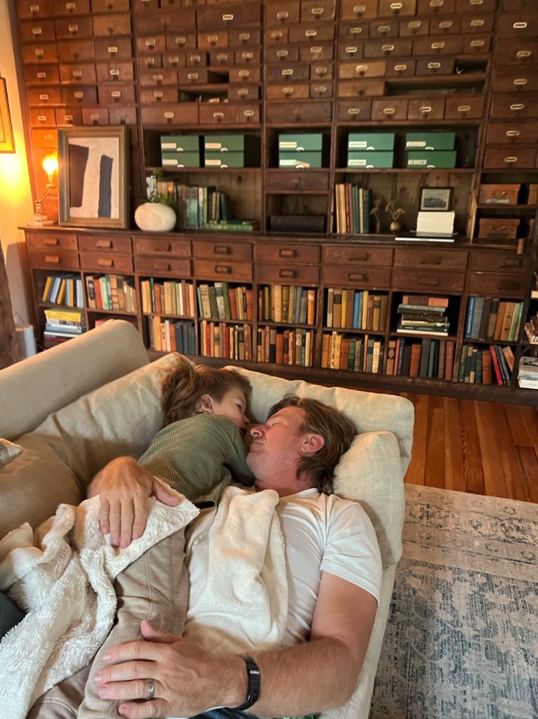 Photo shared by Joanna Gaines on Instagram in honor of Father's Day 2024 featuring her husband Chip Gaines sitting on the couch with their son Crew