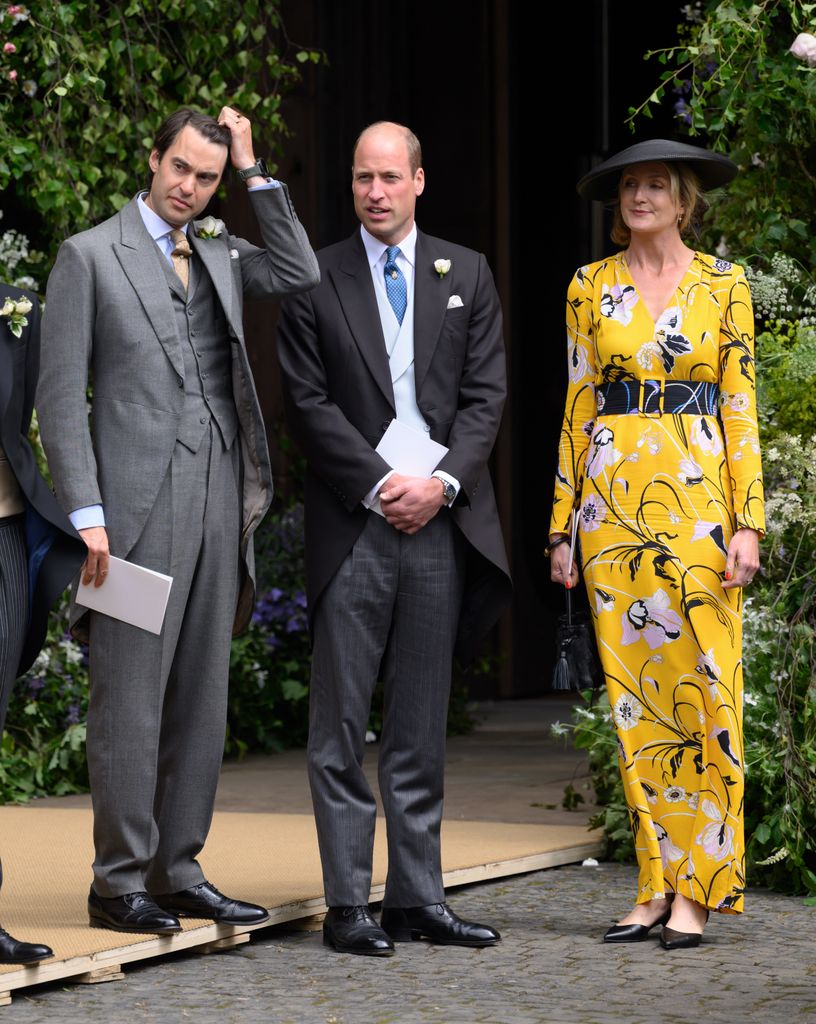 Prince William stands between William van Cutsem and Rosie van Cutsem as they leave after attending the wedding of the Duke of Westminster and Olivia Grosvenor