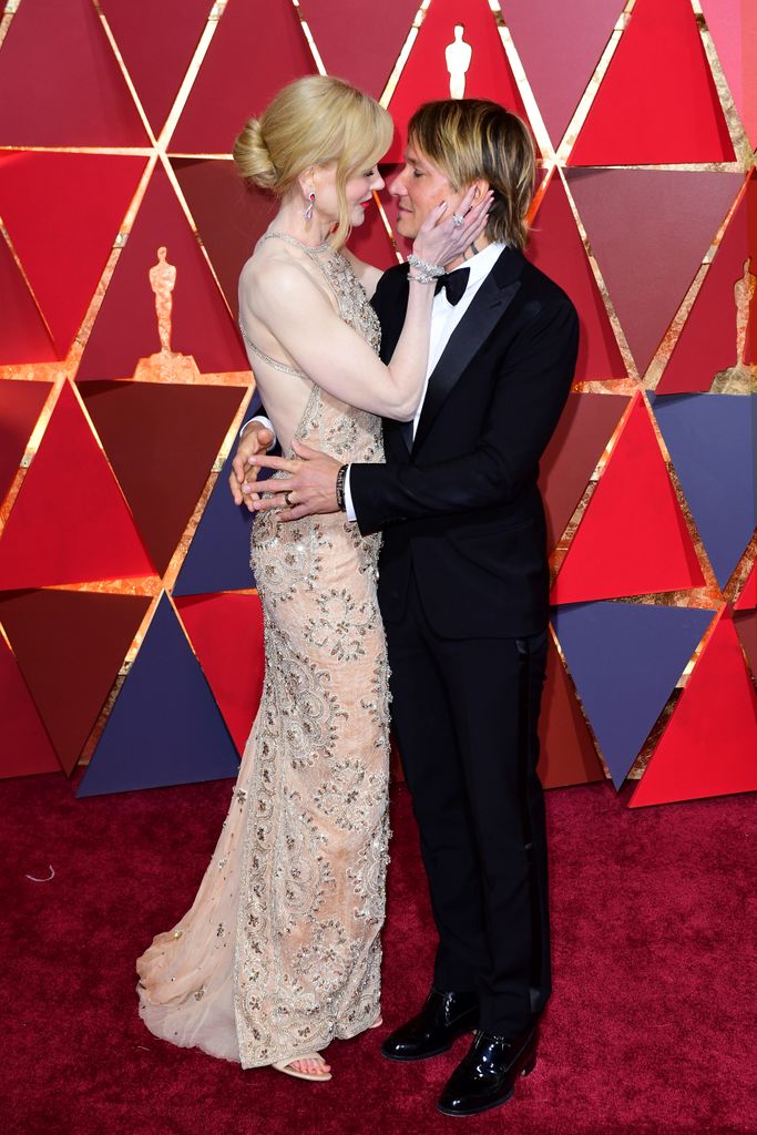 Nicole Kidman and Keith Urban hugging on the red carpet