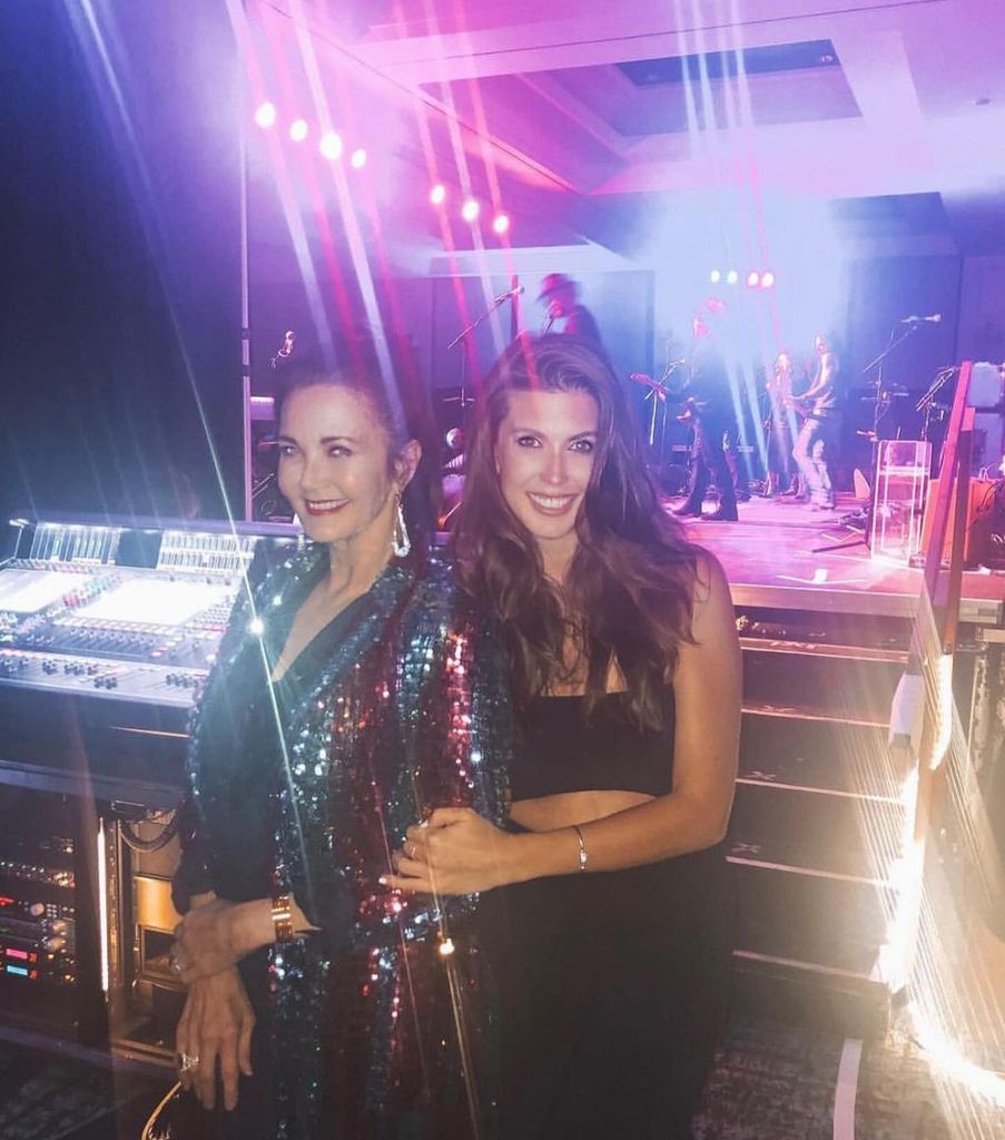 Lynda Carter and her daughter Jessica pose at the edge of the stage 