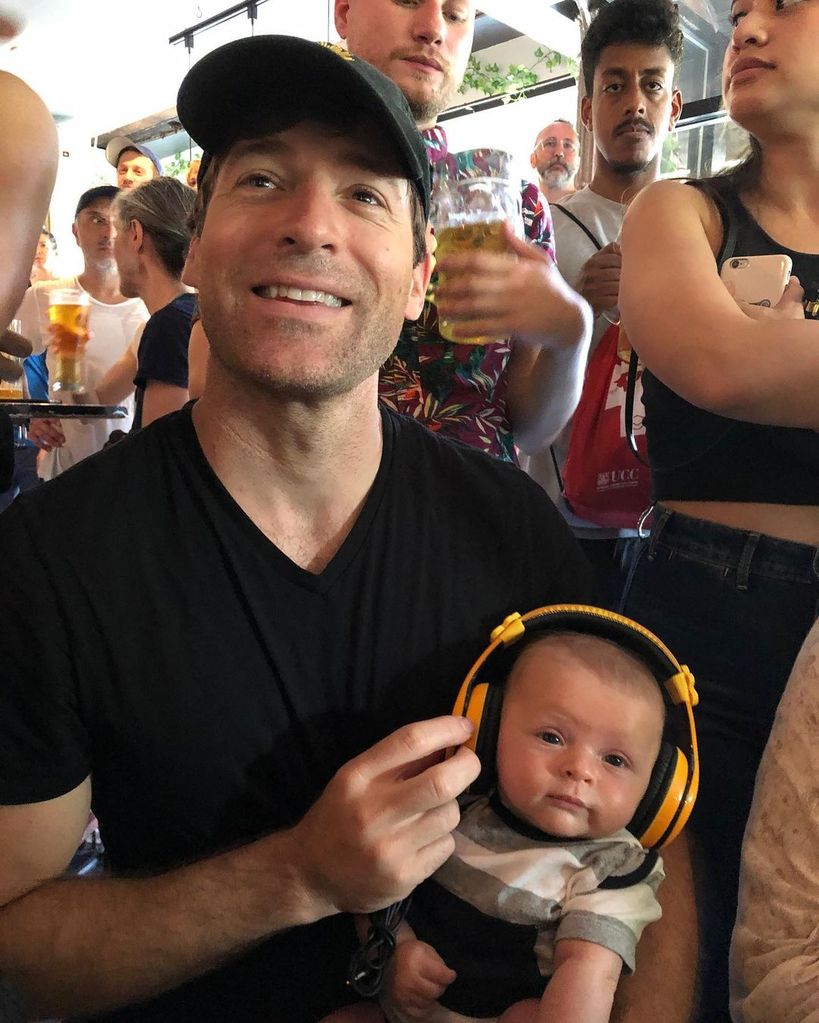Tony Dokoupil sits with son Teddy at a bar