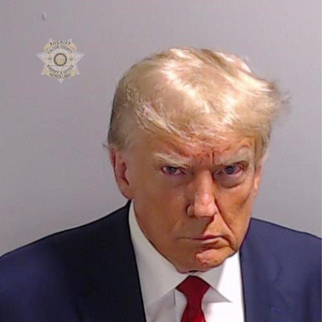 ATLANTA, GEORGIA - AUGUST 24: In this handout provided by the Fulton County Sheriff's Office, former U.S. President Donald Trump poses for his booking photo at the Fulton County Jail on August 24, 2023 in Atlanta, Georgia. Trump was booked on 13 charges related to an alleged plan to overturn the results of the 2020 presidential election in Georgia. Trump and 18 others facing felony charges have been ordered to surrender at the Fulton County Jail by August 25. (Photo by Fulton County Sheriff's Office via Getty Images)
