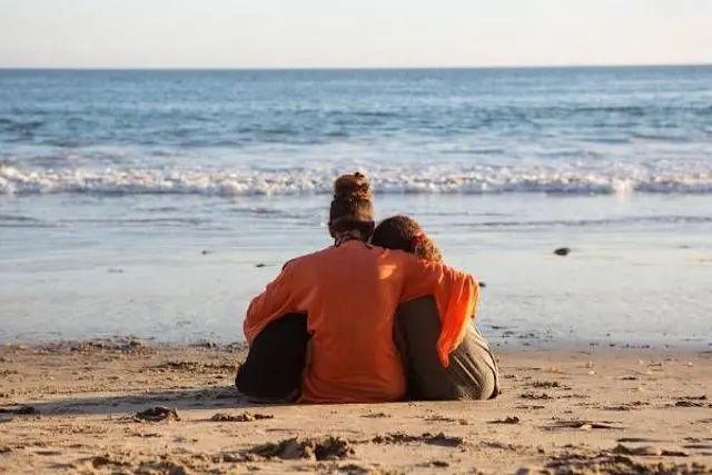Halle Berry cuddling her kids on the beach