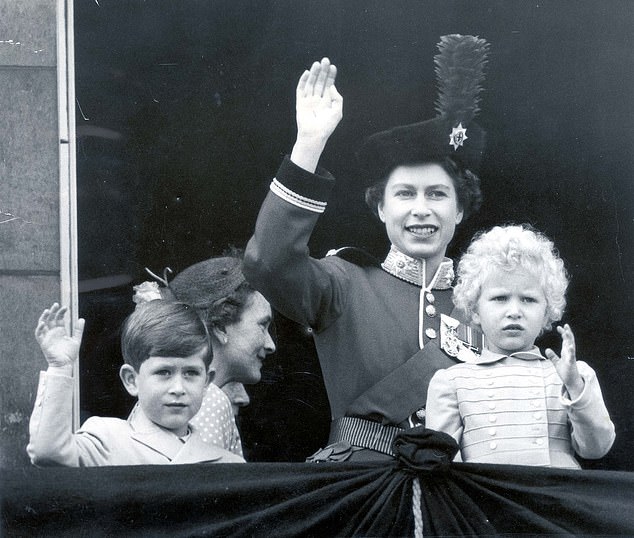 The Queen, Prince Charles and Princess Anne wave from the Buckingham Palace Balcony
