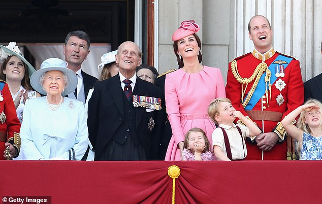 Members of Britain's Royal family from left, Princess Eugenie, Queen Elizabeth II, background Timothy Laurence, Prince Philip, Kate, the Duchess of Cambridge, Princess Charlotte, Prince George and Prince William watched a flypast in 2017